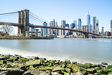 Brooklyn Bridge and Lower Manhattan skyline viewed from Brooklyn side of East River, New York City, United States of America, North America