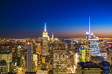 Manhattan skyline and Empire State Building at dusk, New York City, United States of America, North America