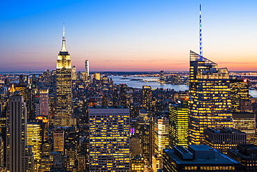 Manhattan skyline and Empire State Building at dusk, New York City, United States of America, North America