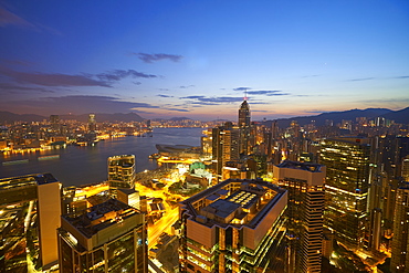 Hong Kong skyline just before sunrise looking from Hong Kong Island across Victoria Harbour to Kowloon, Hong Kong, China, Asia