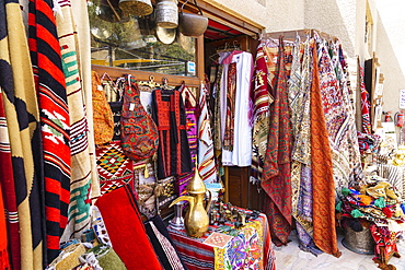 Colourful rugs and carpets for sale in Al Fahidi Historic Neighbourhood, Bur Dubai, Dubai, United Arab Emirates, Middle East