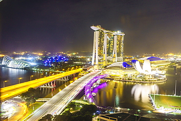 Busy roads leading to the Marina Bay Sands, Gardens by the Bay and ArtScience Museum at night, Singapore, Southeast Asia, Asia