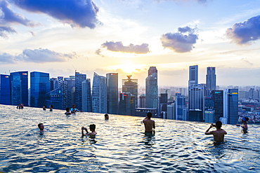 Infinity pool on the roof of the Marina Bay Sands Hotel with spectacular views over the Singapore skyline at sunset, Singapore, Southeast Asia, Asia