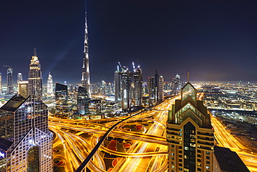 Dubai skyline and Sheikh Zayed Road Interchange by night, Dubai, United Arab Emirates, Middle East