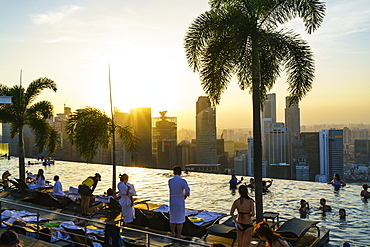 Infinity pool on the roof of the Marina Bay Sands Hotel with spectacular views over the Singapore skyline at sunset, Singapore, Southeast Asia, Asia