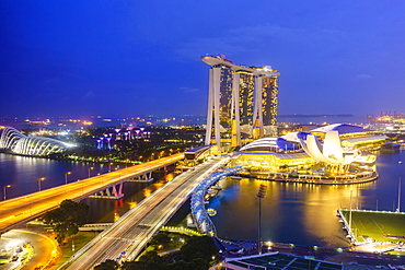 Busy roads leading to the Marina Bay Sands, Gardens by the Bay and ArtScience Museum at night, Singapore, Southeast Asia, Asia