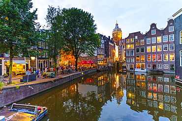 Restaurants by a canal at dusk, Oudezijds Kolk, Amsterdam, North Holland, The Netherlands, Europe