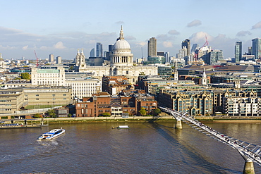 High view of St. Paul's Cathedral and City of London skyline with River Thames and Millennium Bridge in foreground, London, England, United Kingdom, Europe