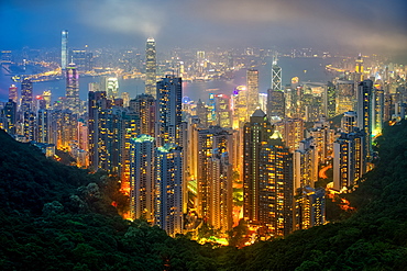 Fog envelops Hong Kong on a summer night seen from Victoria Peak, Hong Kong, China, Asia