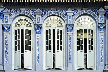 Traditional shophouse windows open out onto a street in the Orchard Road neighborhood in Singapore, Southeast Asia, Asia