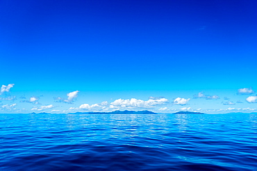 Blue sky and ocean with islands in the background, Queensland, Australia, Pacific