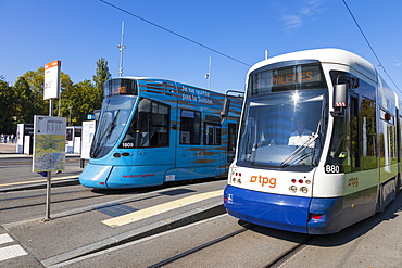 Flexity Outlook Cityrunner on right and Tango on left, trams at Place des Nations, Geneva, Switzerland, Europe