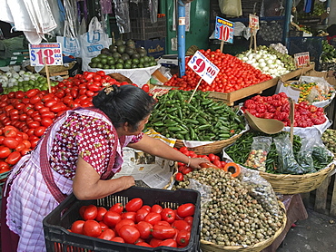 Woman selling produce at a traditional market, Oaxaca, Mexico, North America