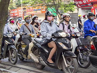 Motorbike traffic and facemasks, Hanoi, Vietnam, Indochina, Southeast Asia, Asia