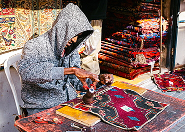 A man hand making a carpet in Tel Aviv, Israel, Middle East