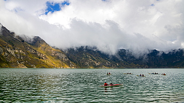 Kayaks at Quilotoa, a water-filled caldera and the most western volcano in the Ecuadorian Andes, Ecuador, South America