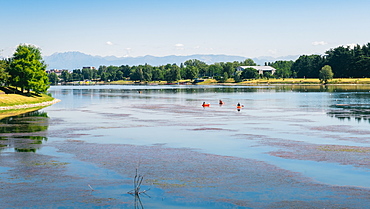 Kayaks at Idroscalo, a large park just outside the city centre on a summer's day, with Alps visible, Milan, Lombardy, Italy, Europe