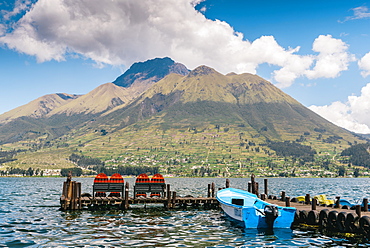 A pier and boat at the base of Volcan Imbabura and Lago San Pablo, close to the famous market town of Otovalo, Ecuador, South America