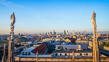 Downtown Milan as seen through the roof of the city's famous Duomo cathedral, Milan, Lombardy, Italy, Europe