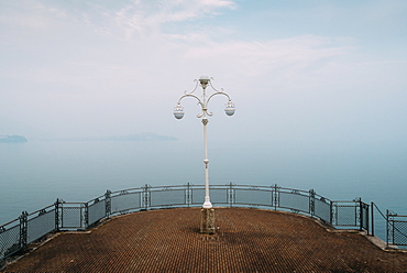 A symmetrical spot with a lamp overlooking Lake Maggiore, Piedmont, Italian Lakes, Italy, Europe