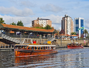 Vintage mahogany motorboats by the Fluvial Station on the Tigre River Canal, Tigre, Buenos Aires Province, Argentina, South America