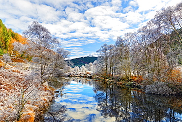 A tranquil view of Loch Doilet and surrounding trees on a calm and frosty winter morning in the Ardnamurchan Peninsula, Scotland, United Kingdom, Europe