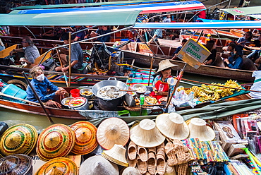 Ladies selling fried bananas at The Damnoen Saduak Floating River Market, Bangkok, Thailand, Southeast Asia, Asia