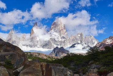 Monte Fitz Roy framed by rocks and trees near Arroyo del Salto in Patagonia, Argentina, South America