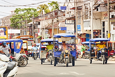 Mototaxis in a busy street in Iquitos, Peru, South America