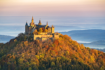 Hohenzollern castle in autumnal scenery at dawn, Hechingen, Baden-Wurttemberg, Germany, Europe