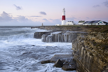 Rough seas crash over rocks near Portland Bill Lighthouse, Dorset, England, United Kingdom, Europe