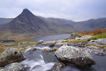 Water cascading down a fall on the Afon Lloer, overlooking the Ogwen Valley and Tryfan in the Glyderau mountain range, Snowdonia, Wales, United Kingdom, Europe