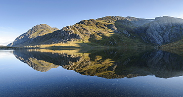 Tryfan reflected in the water of Llyn Idwal in Snowdonia, Wales, United Kingdom, Europe