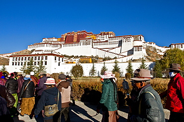 The Potala Palace, UNESCO World Heritage Site, with Tibetan Buddhist devotees, Lhasa, Tibet, China, Asia