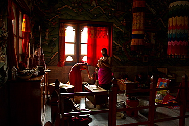 Buddhist monks from Bhutan make candles in their Bhutan Temple in Bodh Gaya, Bihar, India, Asia