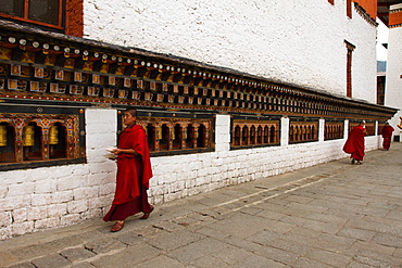 Monks and prayer wheels, Tashi Chho Dzong Fortress, Thimpu, Bhutan, Asia