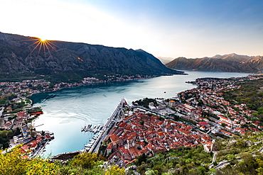 Looking over the old town of Kotor and across the Bay of Kotor viewed from the fortress at sunset, UNESCO World Heritage Site, Montenegro, Europe