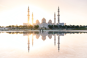 Abu Dhabi's magnificent Grand Mosque viewed in a reflecting pool, Abu Dhabi, United Arab Emirates, Middle East