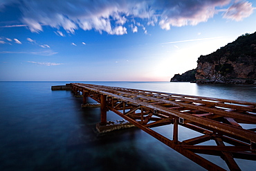 A long exposure during sunset of an old jetty on the beach of Budva's old town (stari grad), Montenegro, Europe