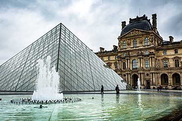 The large pyramid sits in the main courtyard and is the main entrance to the Louvre Museum, Paris, France, Europe