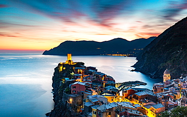 Long exposure at blue hour to capture the end of a stunning sunset and the lights of the old town, Vernazza, Cinque Terre, UNESCO World Heritage Site, Liguria, Italy, Europe