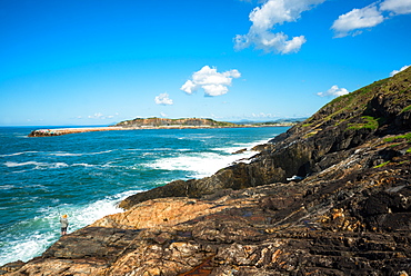 A lone fisherman sea fishing on Muttonbird Island, Coffs Harbour, New South Wales, Australia, Pacific