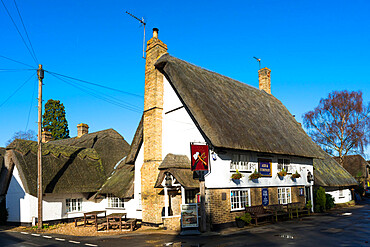 Traditional village pub Axe and Compass with thatched roof at Hemingford Abbots, Cambridgeshire, England, United Kingdom, Europe