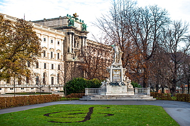 Mozart statue in Burggarten in front of Neue Burg building, part of the Hofburg Palace, Vienna, Austria, Europe