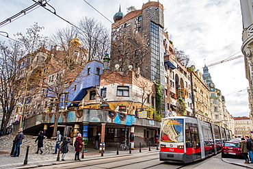 Tram at Hundertwasserhaus, expressionist landmark and public housing, designed by Friedenreich Hundertwasser in Vienna, Austria, Europe