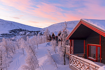 Sunrise at the picturesque Bjorkliden houses, Bjorkliden, Norbottens Ian, Sweden, Scandinavia, Europe