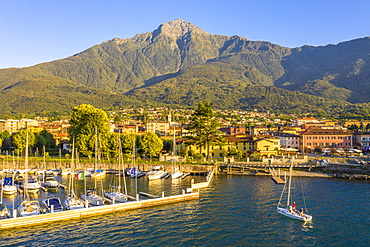 Sailing boat arrived at the port of Colico village, Lake Como, Lombardy, Italian Lakes, Italy, Europe