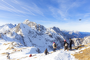 Tourists descends from Hafelekar peak, the top of ski resorts of Innsbruck, Tyrol, Austria, Europe