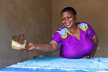 A woman making a new batik print, Tanzania, East Africa, Africa