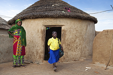 Mother and daughter outside their house, Ghana, West Africa, Africa